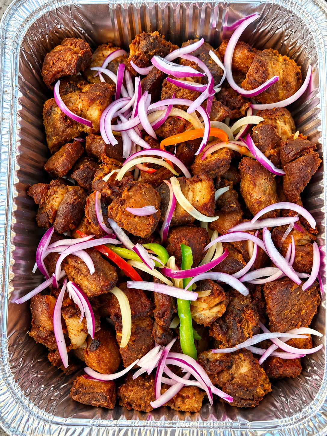 Fried chicken with onions and peppers